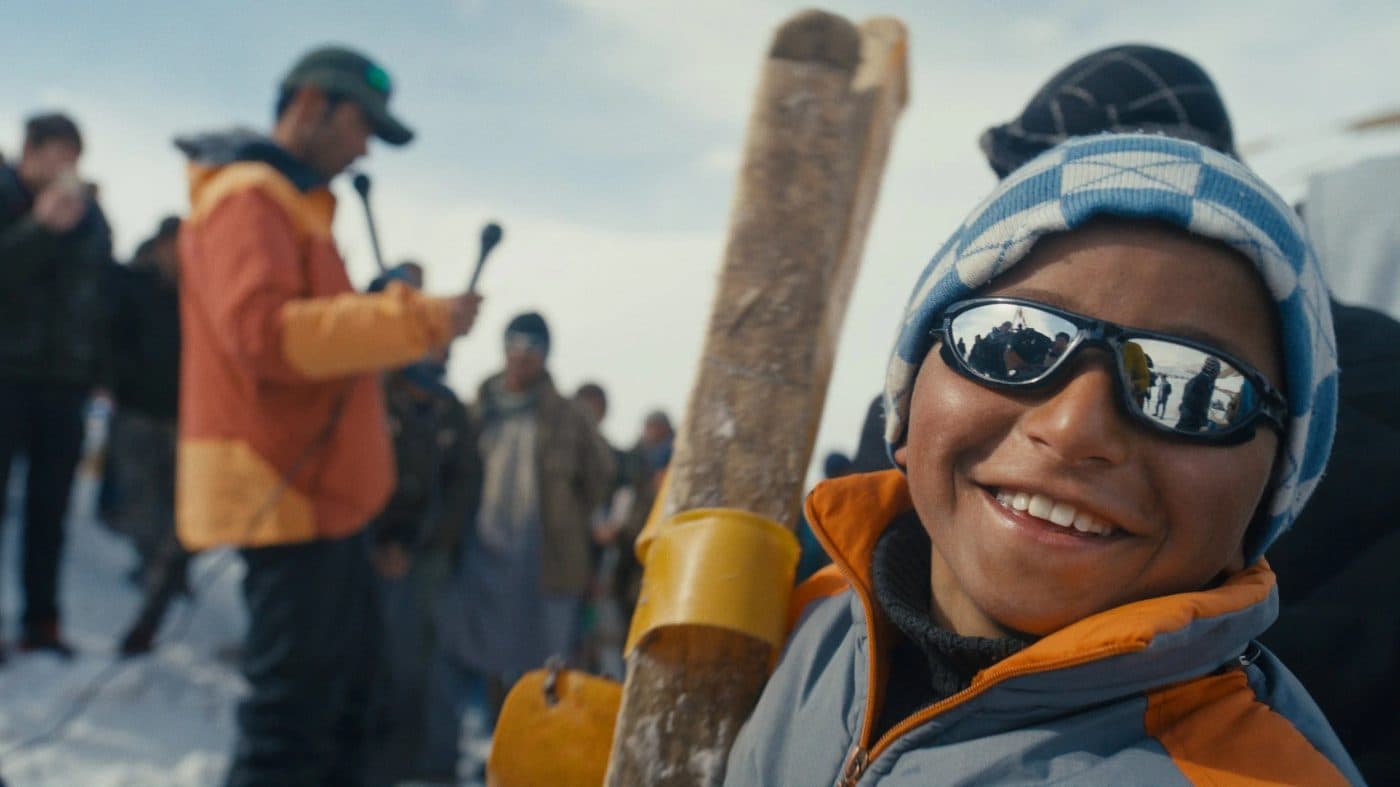 A young skier smiling at the race in Bamyan, from Champions of the Golden Valley